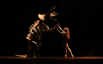 Dancer with Triceratops performing in MOMIX: Botanica