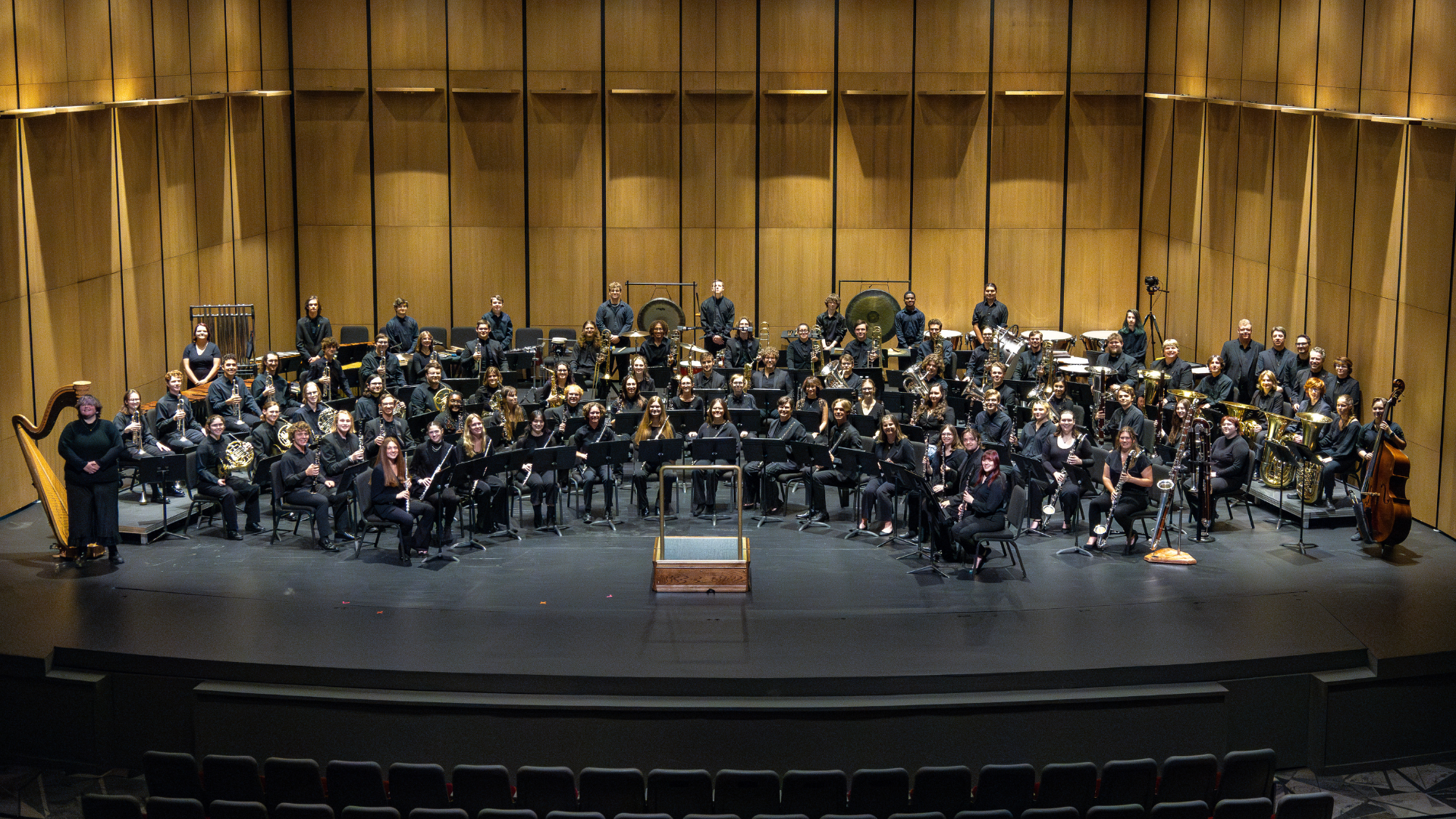 The Appalachian Symphony band posing on the Schaefer Center stage